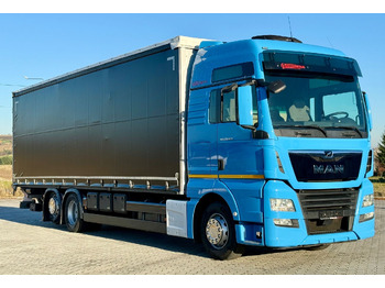 Φορτηγό μουσαμάς MAN TGX