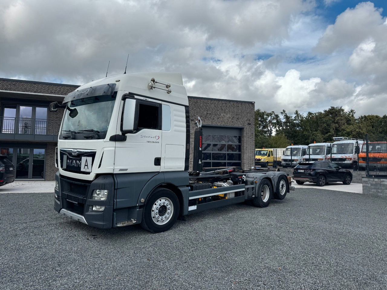 MAN TGX 26.520 D38 Abrollkipper Multilift - Φορτηγό φόρτωσης γάντζου: φωτογραφία 2 MAN TGX 26.520 D38 Abrollkipper Multilift - Φορτηγό φόρτωσης γάντζου: φωτογραφία 2