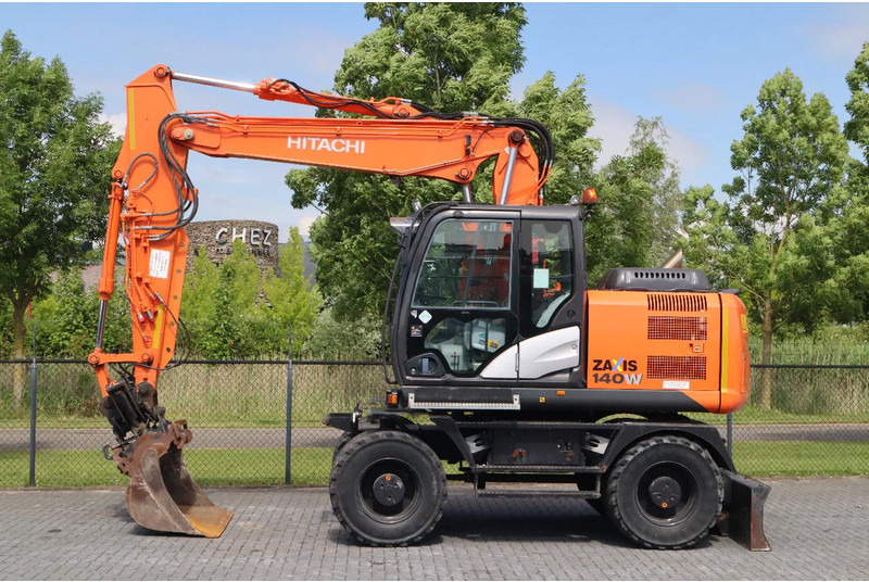 Hitachi ZX 140 W-5B | TILT QC | BUCKET | DOZER BLADE | DUTCH REG. - Τροχοφόρος εκσκαφέας: φωτογραφία 1 Hitachi ZX 140 W-5B | TILT QC | BUCKET | DOZER BLADE | DUTCH REG. - Τροχοφόρος εκσκαφέας: φωτογραφία 1