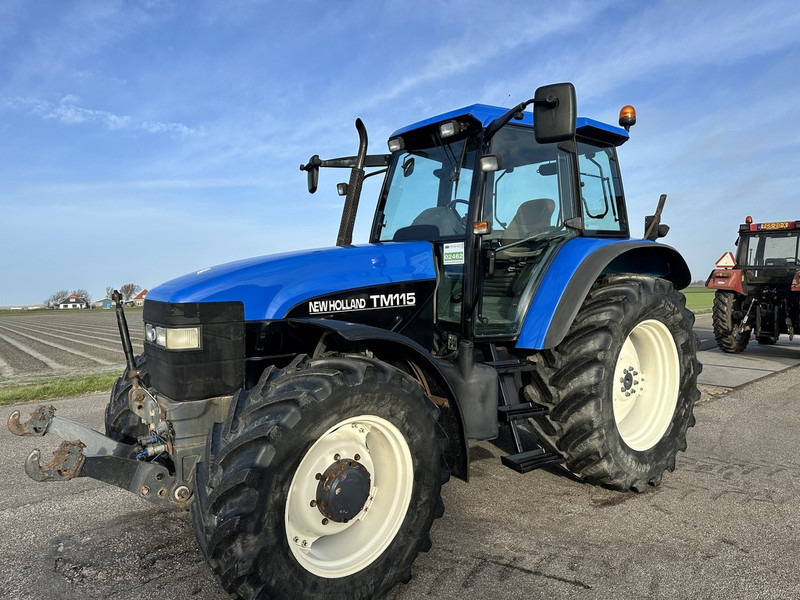 New Holland TM 115 - Τρακτέρ: φωτογραφία 1 New Holland TM 115 - Τρακτέρ: φωτογραφία 1