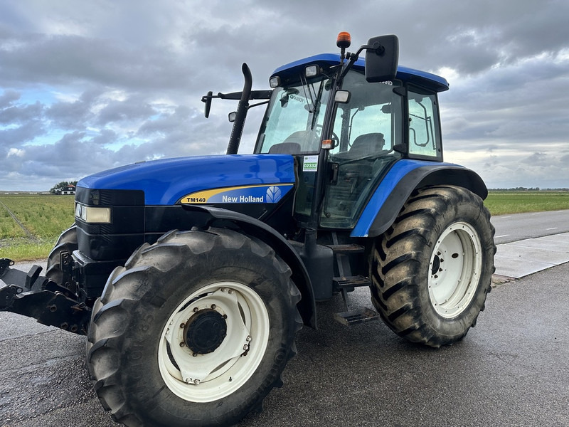 New Holland TM 140 - Τρακτέρ: φωτογραφία 1 New Holland TM 140 - Τρακτέρ: φωτογραφία 1