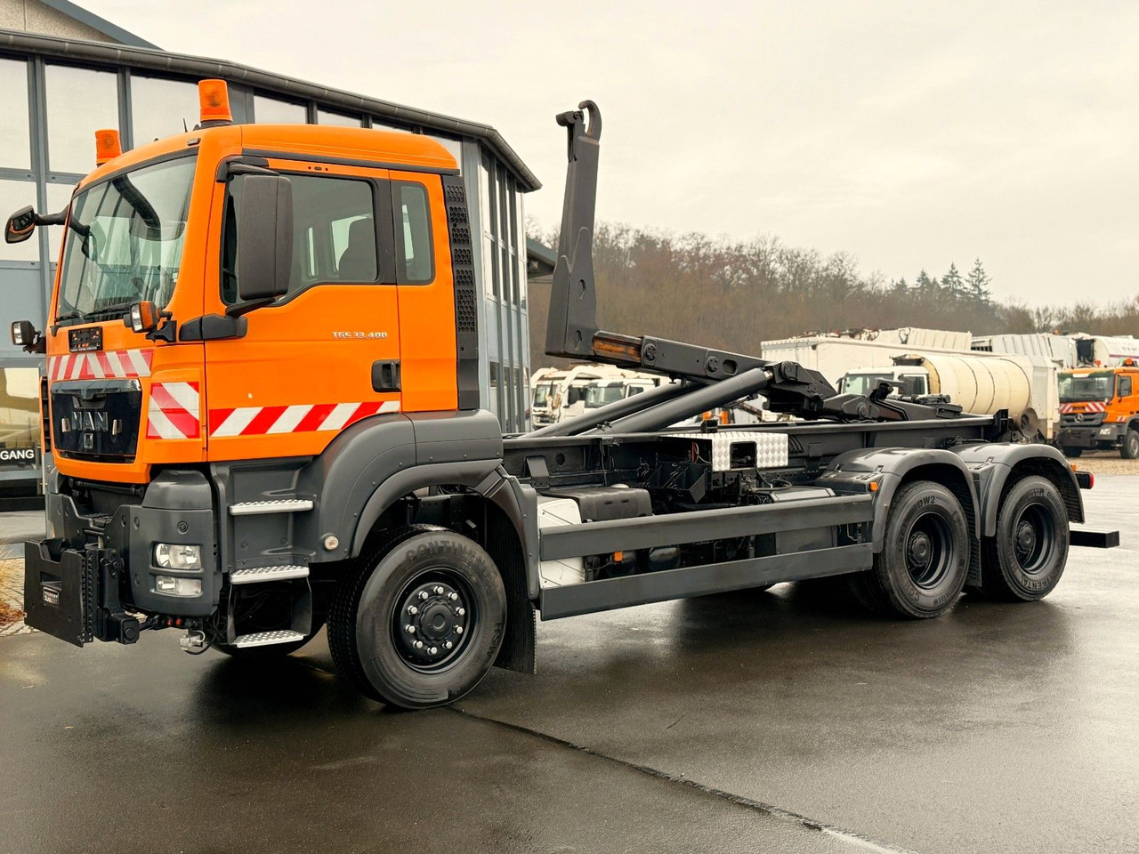 MAN TGS 33.400 6x6 Blattfederung Original 120500 km - Φορτηγό φόρτωσης γάντζου: φωτογραφία 1 MAN TGS 33.400 6x6 Blattfederung Original 120500 km - Φορτηγό φόρτωσης γάντζου: φωτογραφία 1