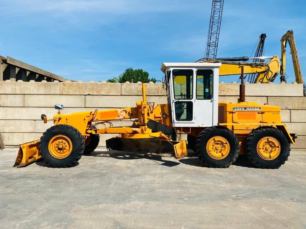 John Deere 570 A - Γκρέιντερ: φωτογραφία 1 John Deere 570 A - Γκρέιντερ: φωτογραφία 1