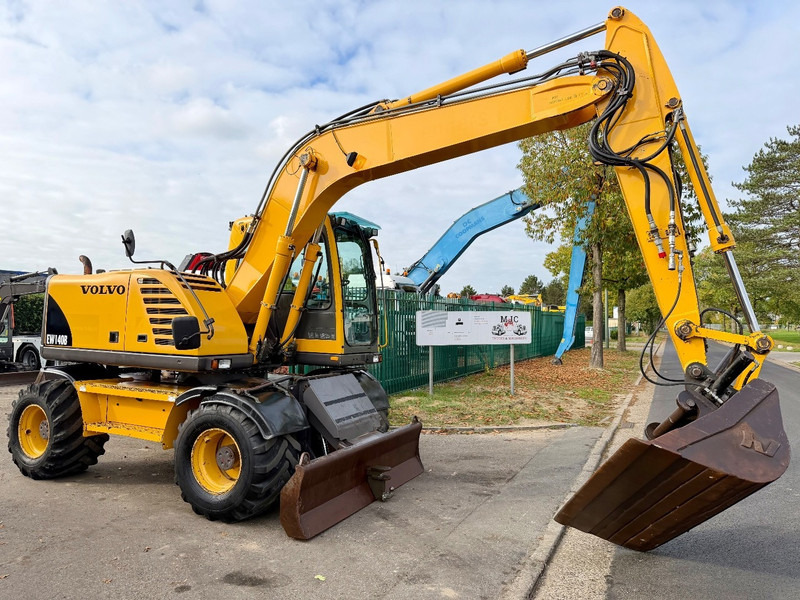 Volvo EW 140 B *FULL HYDR* - BLADE - 10.485h - TILT BUCKET -  CE - NL MACHINE - GOOD CONDITION - Τροχοφόρος εκσκαφέας: φωτογραφία 1 Volvo EW 140 B *FULL HYDR* - BLADE - 10.485h - TILT BUCKET -  CE - NL MACHINE - GOOD CONDITION - Τροχοφόρος εκσκαφέας: φωτογραφία 1