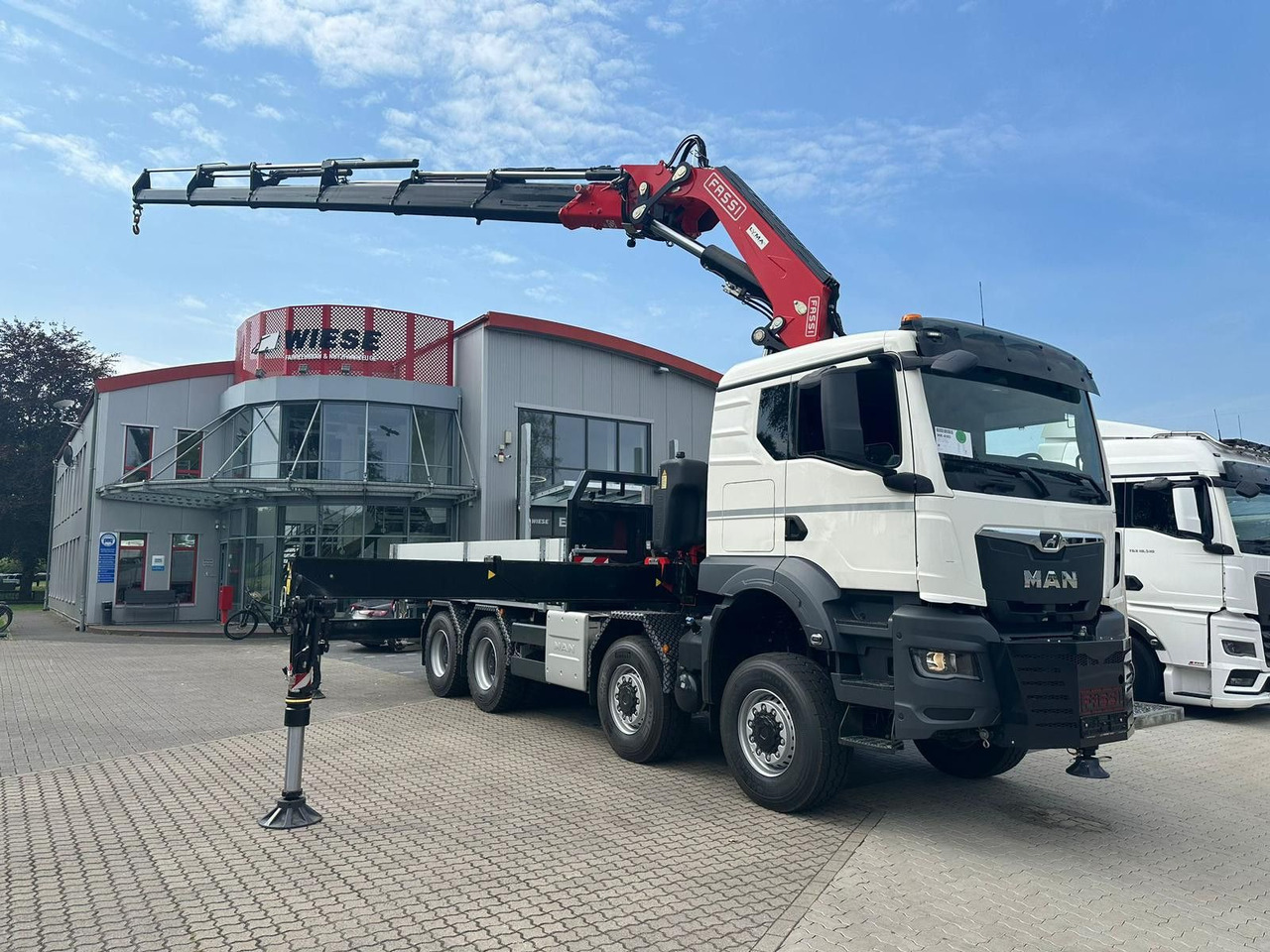 MAN TGS 41.520 8x8 mit Fassi Ladekran F710RA.2.26 - Φορτηγό με γερανό: φωτογραφία 1 MAN TGS 41.520 8x8 mit Fassi Ladekran F710RA.2.26 - Φορτηγό με γερανό: φωτογραφία 1