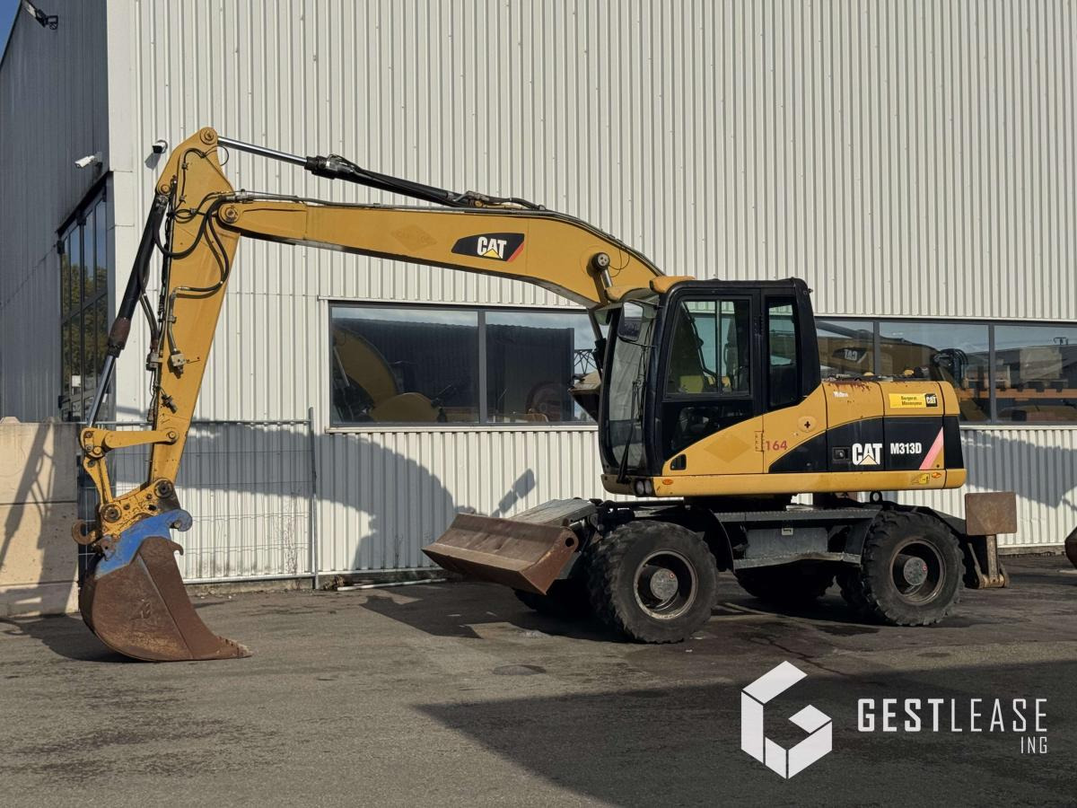 Caterpillar M313D - Τροχοφόρος εκσκαφέας: φωτογραφία 1 Caterpillar M313D - Τροχοφόρος εκσκαφέας: φωτογραφία 1