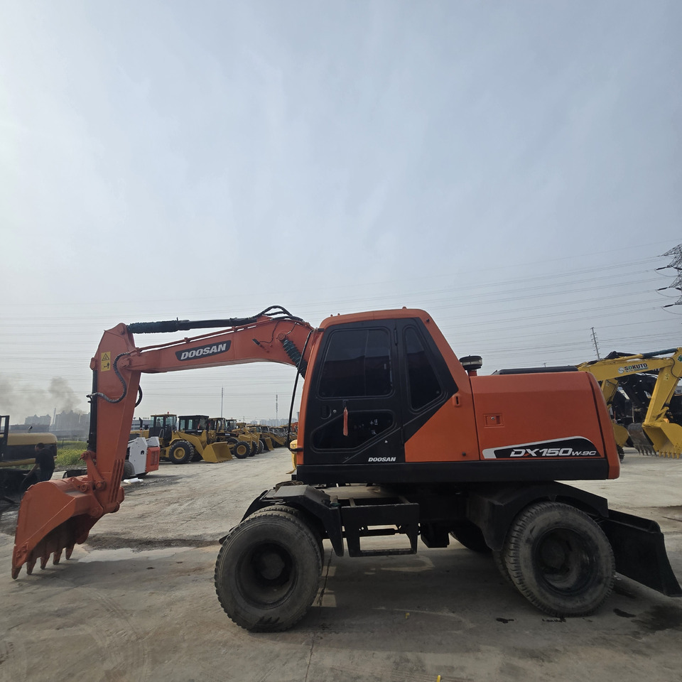 DOOSAN DX150W - Τροχοφόρος εκσκαφέας: φωτογραφία 2 DOOSAN DX150W - Τροχοφόρος εκσκαφέας: φωτογραφία 2