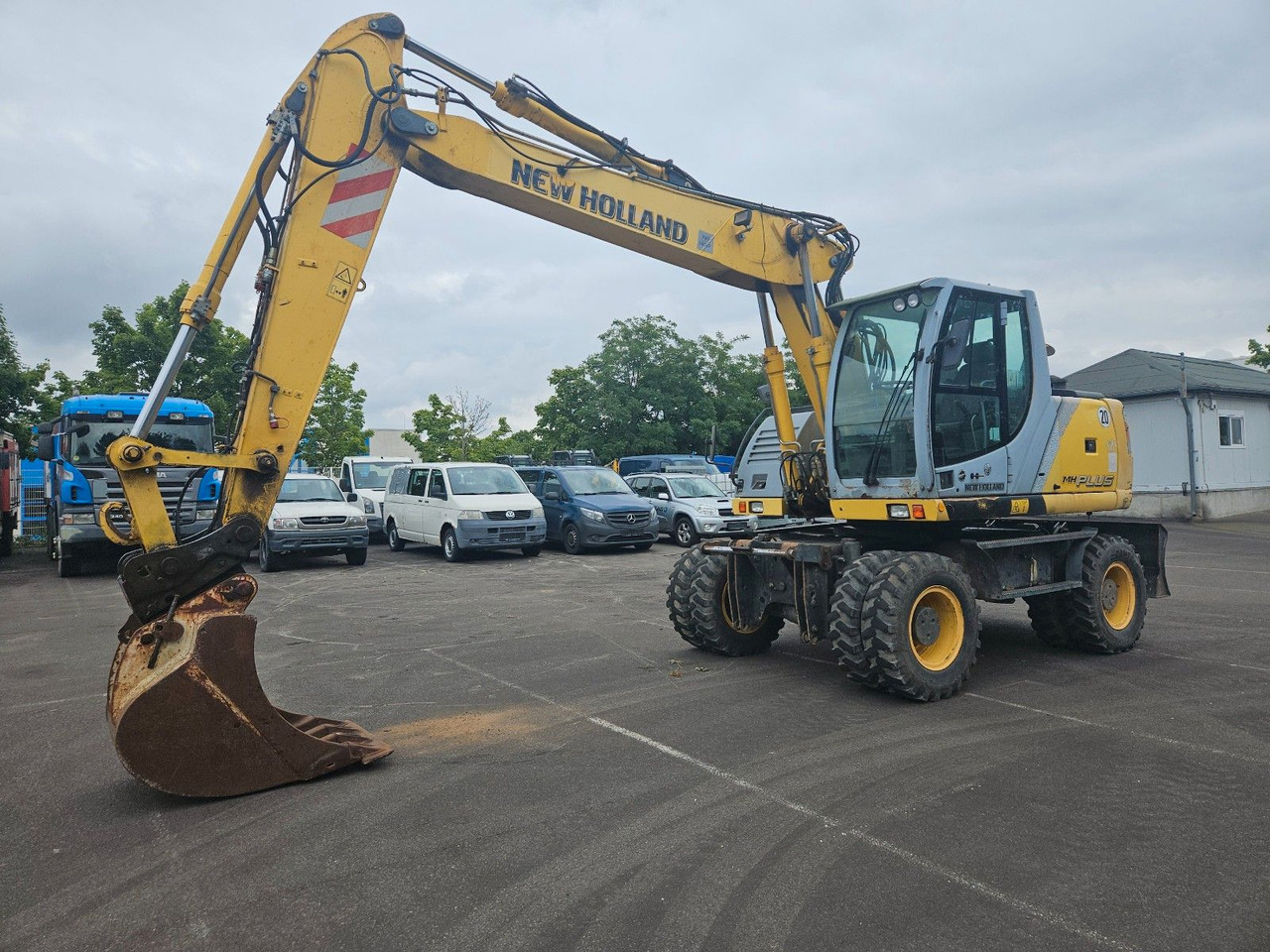 New Holland MH Plus 18t Mobilbagger - Τροχοφόρος εκσκαφέας: φωτογραφία 1 New Holland MH Plus 18t Mobilbagger - Τροχοφόρος εκσκαφέας: φωτογραφία 1
