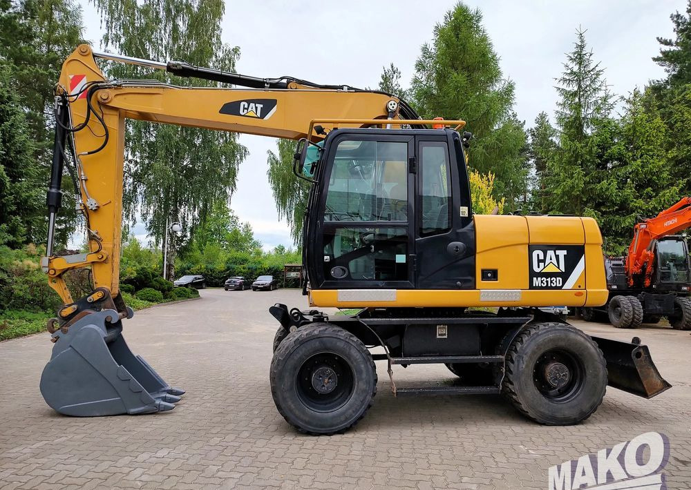 Caterpillar M313D - Τροχοφόρος εκσκαφέας: φωτογραφία 1 Caterpillar M313D - Τροχοφόρος εκσκαφέας: φωτογραφία 1