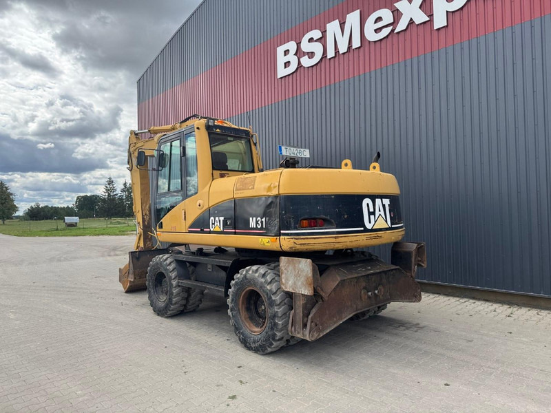 Caterpillar M 315 C - Τροχοφόρος εκσκαφέας: φωτογραφία 4 Caterpillar M 315 C - Τροχοφόρος εκσκαφέας: φωτογραφία 4