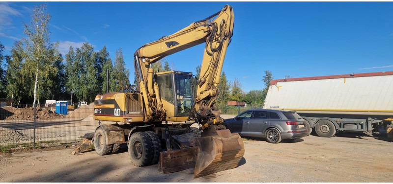 Caterpillar M 315 Rototilt - Τροχοφόρος εκσκαφέας: φωτογραφία 1 Caterpillar M 315 Rototilt - Τροχοφόρος εκσκαφέας: φωτογραφία 1