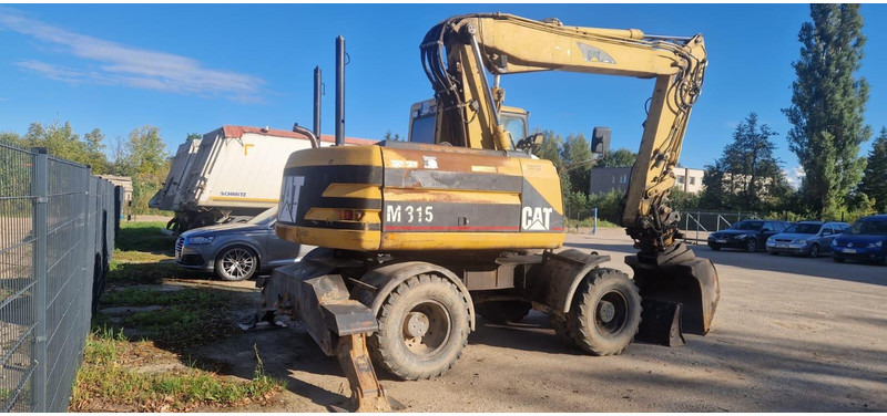 Caterpillar M 315 Rototilt - Τροχοφόρος εκσκαφέας: φωτογραφία 2 Caterpillar M 315 Rototilt - Τροχοφόρος εκσκαφέας: φωτογραφία 2