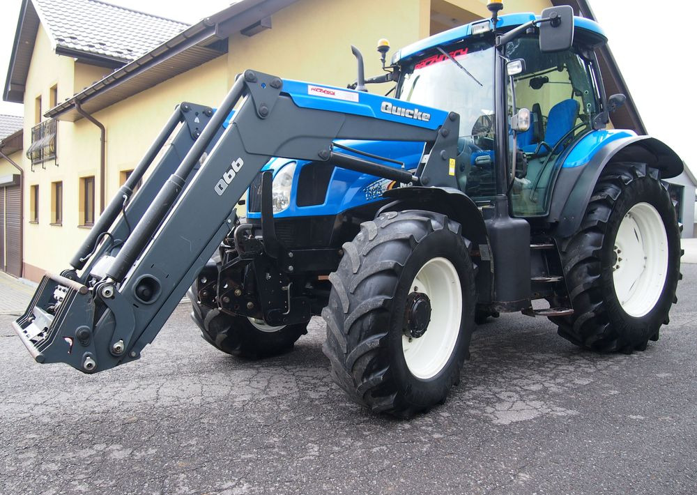 Ciągnik New Holland NH TS125A 6 cylindrów 2004 Ciągnik rolniczy New Holland TS125A - Τρακτέρ: φωτογραφία 1 Ciągnik New Holland NH TS125A 6 cylindrów 2004 Ciągnik rolniczy New Holland TS125A - Τρακτέρ: φωτογραφία 1