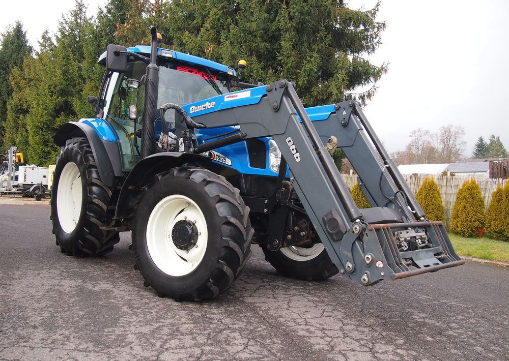 Ciągnik New Holland NH TS125A 6 cylindrów 2004 Ciągnik rolniczy New Holland TS125A - Τρακτέρ: φωτογραφία 2 Ciągnik New Holland NH TS125A 6 cylindrów 2004 Ciągnik rolniczy New Holland TS125A - Τρακτέρ: φωτογραφία 2