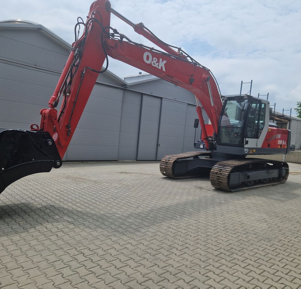 Koparka gąsienicowa O&K RH6,5 2003 Koparka gąsienicowa O&K - Ερπυστριοφόρος εκσκαφέας: φωτογραφία 1 Koparka gąsienicowa O&K RH6,5 2003 Koparka gąsienicowa O&K - Ερπυστριοφόρος εκσκαφέας: φωτογραφία 1