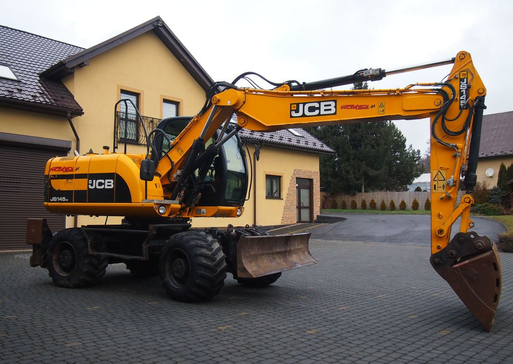 Koparka kołowa JCB JS145W 2011 Koparka JCB - Τροχοφόρος εκσκαφέας: φωτογραφία 1 Koparka kołowa JCB JS145W 2011 Koparka JCB - Τροχοφόρος εκσκαφέας: φωτογραφία 1