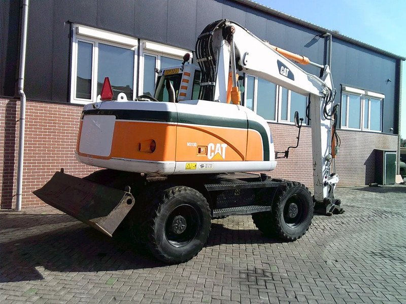 Caterpillar M313D - Τροχοφόρος εκσκαφέας: φωτογραφία 4 Caterpillar M313D - Τροχοφόρος εκσκαφέας: φωτογραφία 4