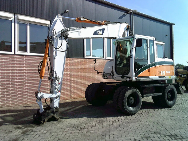 Caterpillar M313D - Τροχοφόρος εκσκαφέας: φωτογραφία 1 Caterpillar M313D - Τροχοφόρος εκσκαφέας: φωτογραφία 1