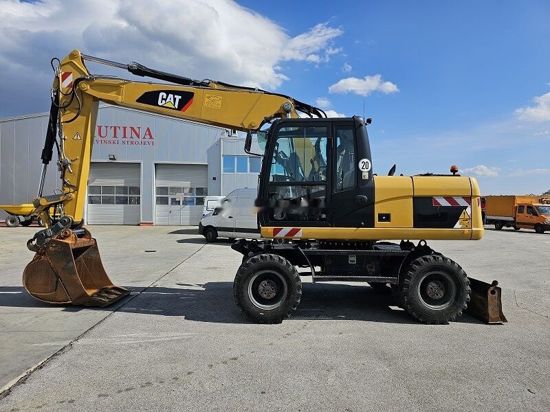 Caterpillar M315D - Τροχοφόρος εκσκαφέας: φωτογραφία 1 Caterpillar M315D - Τροχοφόρος εκσκαφέας: φωτογραφία 1