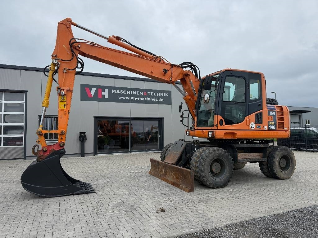 Komatsu PW 148-8 - Τροχοφόρος εκσκαφέας: φωτογραφία 1 Komatsu PW 148-8 - Τροχοφόρος εκσκαφέας: φωτογραφία 1