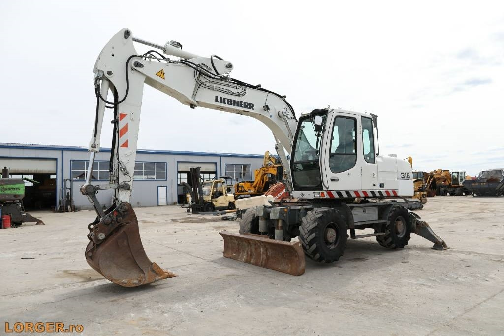 Liebherr A 316 Litronic - Τροχοφόρος εκσκαφέας: φωτογραφία 5 Liebherr A 316 Litronic - Τροχοφόρος εκσκαφέας: φωτογραφία 5