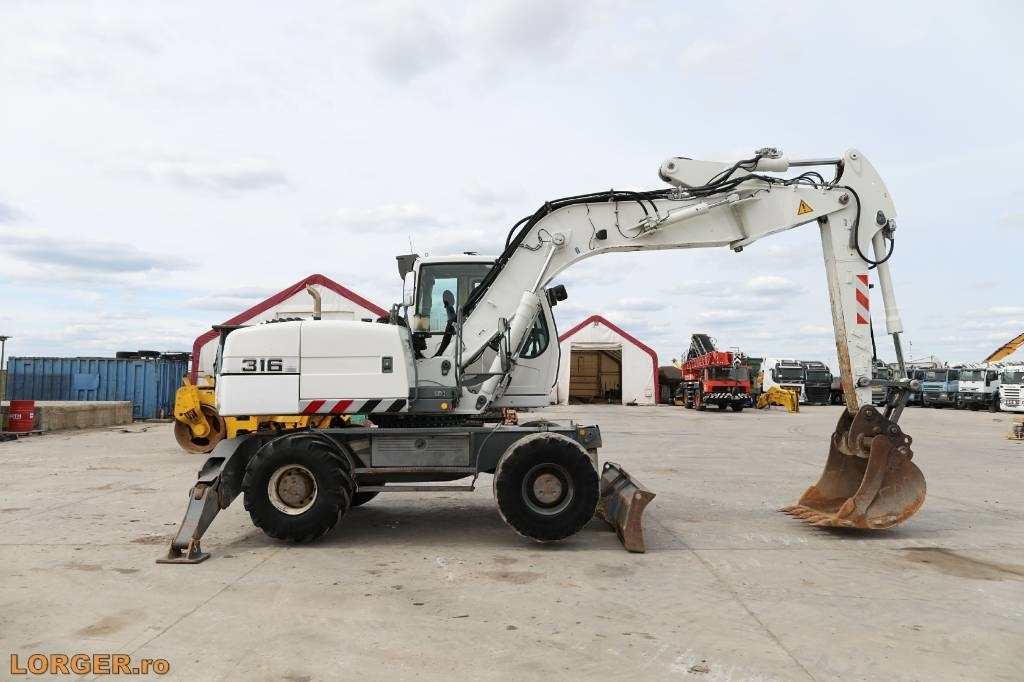 Liebherr A 316 Litronic - Τροχοφόρος εκσκαφέας: φωτογραφία 1 Liebherr A 316 Litronic - Τροχοφόρος εκσκαφέας: φωτογραφία 1
