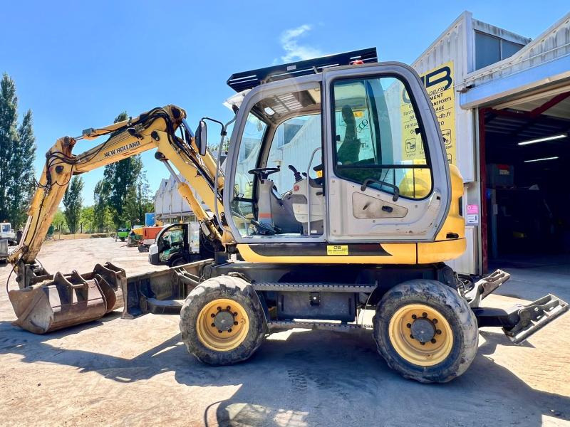 New Holland MH 2.6 PELLE A PNEUS 10T - Τροχοφόρος εκσκαφέας: φωτογραφία 2 New Holland MH 2.6 PELLE A PNEUS 10T - Τροχοφόρος εκσκαφέας: φωτογραφία 2