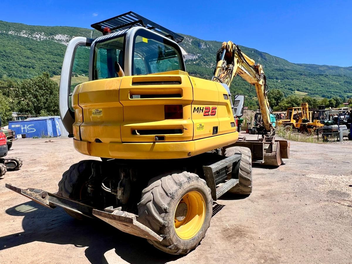 New Holland MH 2.6 PELLE A PNEUS 10T - Τροχοφόρος εκσκαφέας: φωτογραφία 4 New Holland MH 2.6 PELLE A PNEUS 10T - Τροχοφόρος εκσκαφέας: φωτογραφία 4