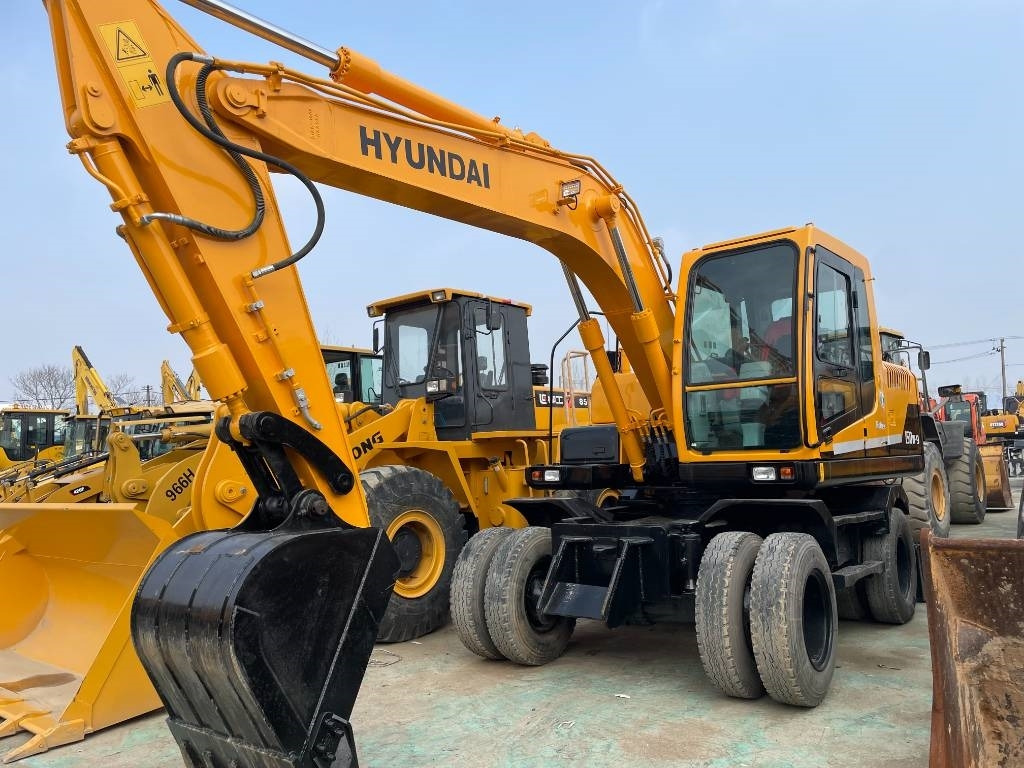 Hyundai R150W - Τροχοφόρος εκσκαφέας: φωτογραφία 1 Hyundai R150W - Τροχοφόρος εκσκαφέας: φωτογραφία 1