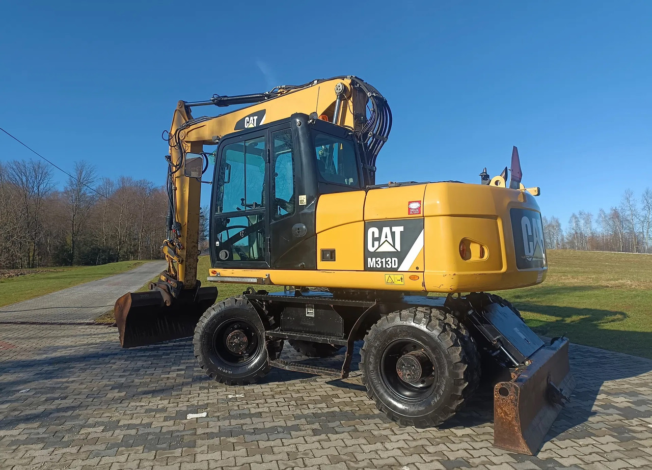 CATERPILLAR M313D - Τροχοφόρος εκσκαφέας: φωτογραφία 1 CATERPILLAR M313D - Τροχοφόρος εκσκαφέας: φωτογραφία 1