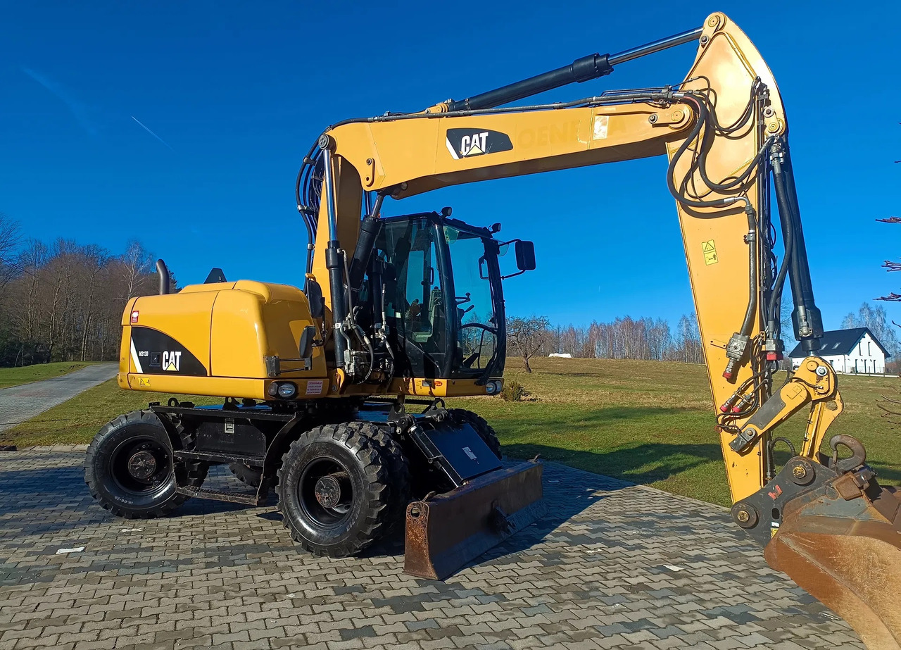 CATERPILLAR M313D - Τροχοφόρος εκσκαφέας: φωτογραφία 2 CATERPILLAR M313D - Τροχοφόρος εκσκαφέας: φωτογραφία 2