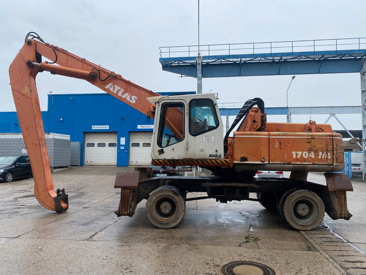 Atlas 1704 MI mit Greifer Umschlagbagger Lang - Τροχοφόρος εκσκαφέας: φωτογραφία 1 Atlas 1704 MI mit Greifer Umschlagbagger Lang - Τροχοφόρος εκσκαφέας: φωτογραφία 1