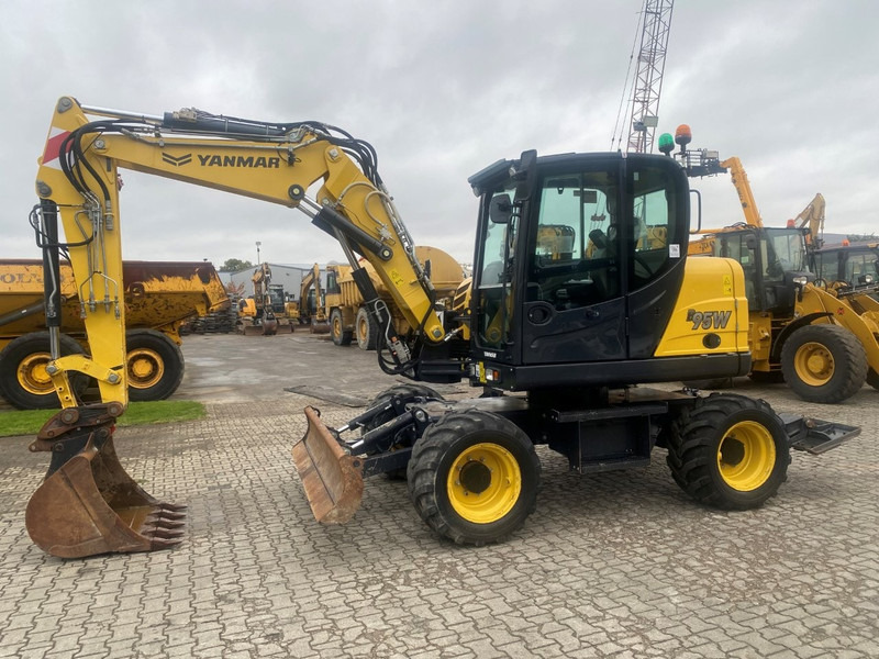 Yanmar B95w NVT - Τροχοφόρος εκσκαφέας: φωτογραφία 1 Yanmar B95w NVT - Τροχοφόρος εκσκαφέας: φωτογραφία 1