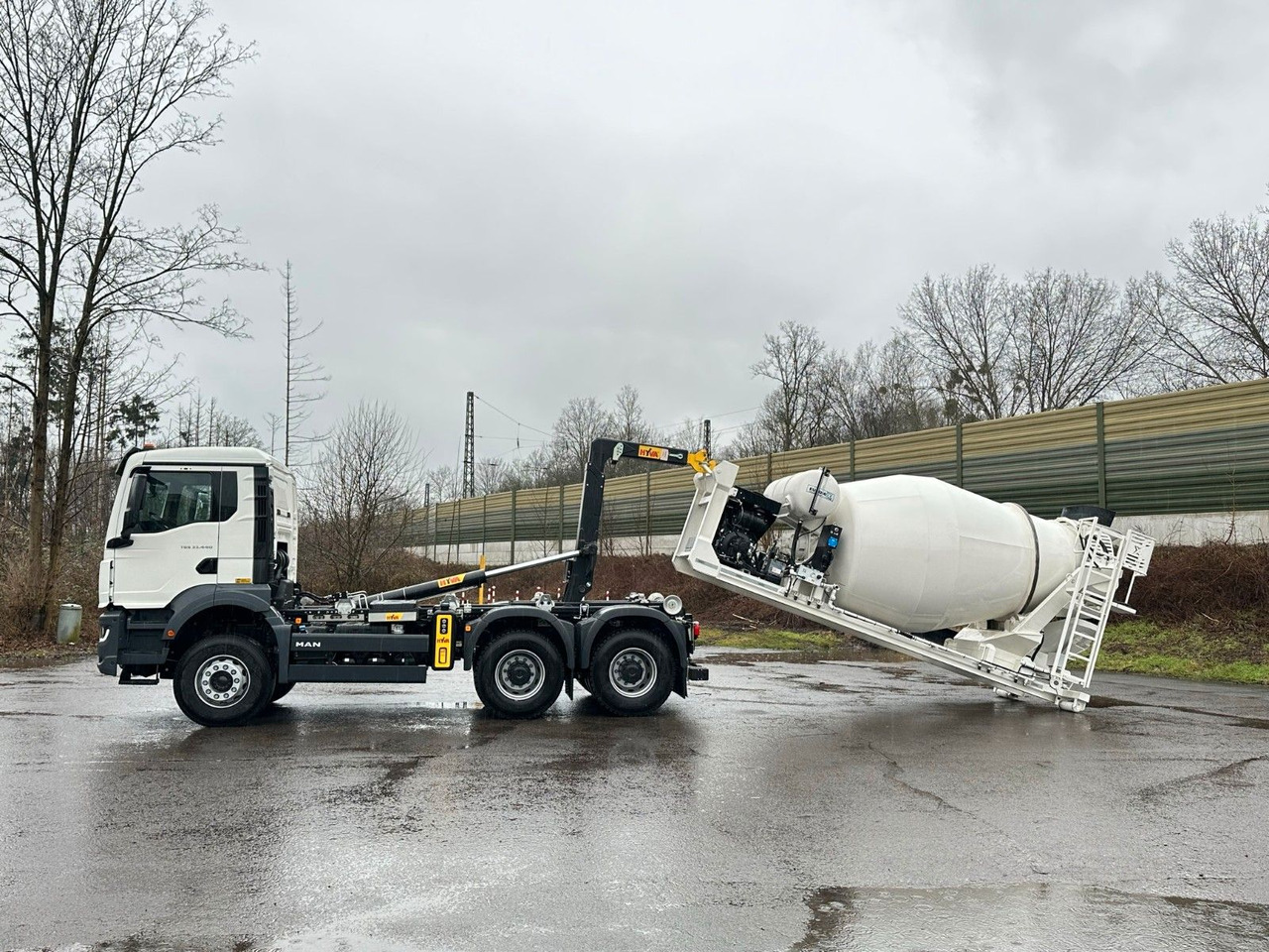 MAN TGS 33.440 6x4 Euro6e Abroller + Fahrmischer - Φορτηγό φόρτωσης γάντζου, Φορτηγό με γερανό: φωτογραφία 1 MAN TGS 33.440 6x4 Euro6e Abroller + Fahrmischer - Φορτηγό φόρτωσης γάντζου, Φορτηγό με γερανό: φωτογραφία 1