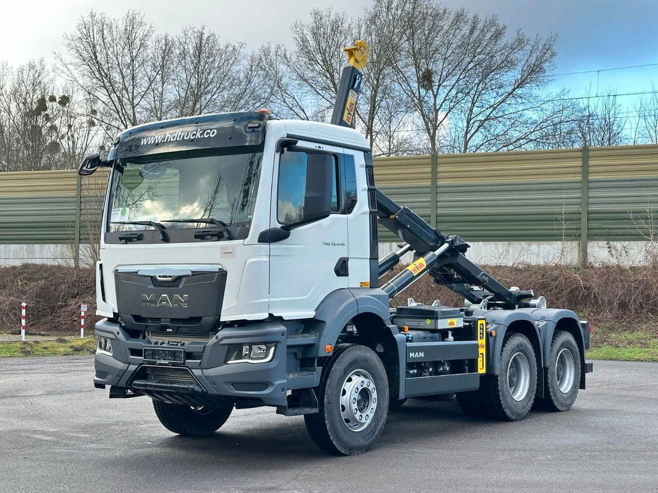 MAN TGS 33.440 6x4 Euro6e Abrollkipper Hyva - Φορτηγό φόρτωσης γάντζου, Φορτηγό με γερανό: φωτογραφία 1 MAN TGS 33.440 6x4 Euro6e Abrollkipper Hyva - Φορτηγό φόρτωσης γάντζου, Φορτηγό με γερανό: φωτογραφία 1