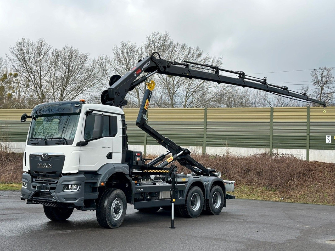 MAN TGS 33.440 6x6 BB Abrollkipper+Kran Hiab 228-6 - Φορτηγό φόρτωσης γάντζου, Φορτηγό με γερανό: φωτογραφία 1 MAN TGS 33.440 6x6 BB Abrollkipper+Kran Hiab 228-6 - Φορτηγό φόρτωσης γάντζου, Φορτηγό με γερανό: φωτογραφία 1