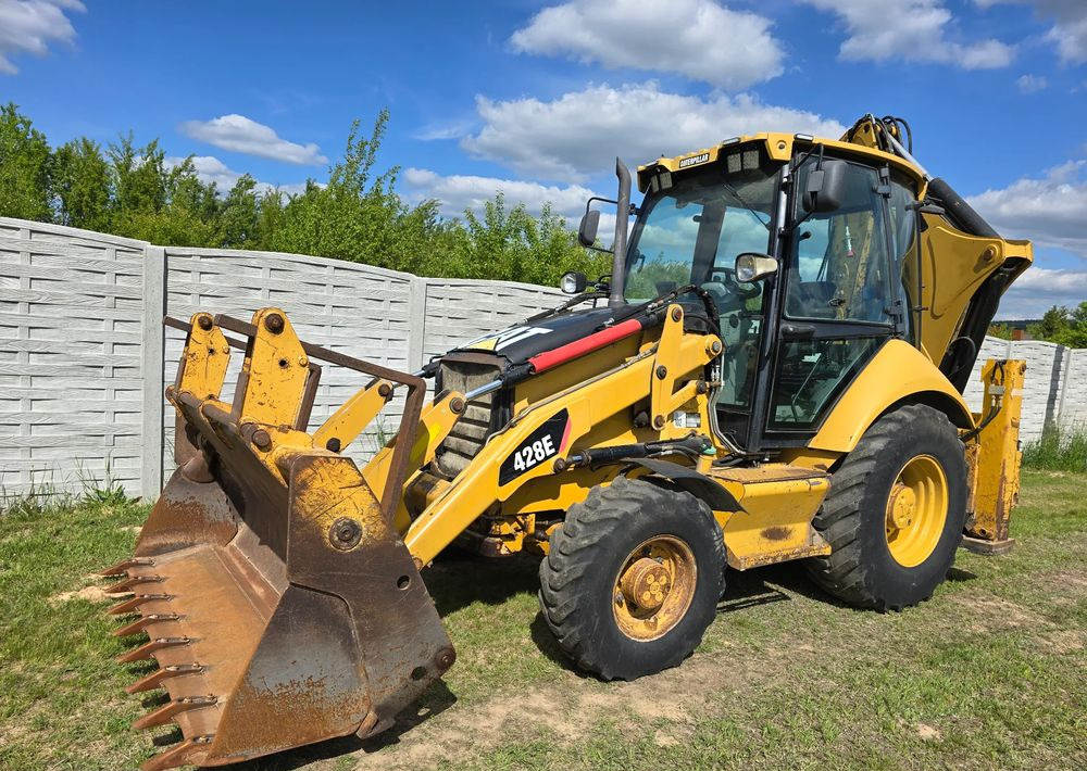 Caterpillar - Φορτωτής εκσκαφέας: φωτογραφία 1 Caterpillar - Φορτωτής εκσκαφέας: φωτογραφία 1