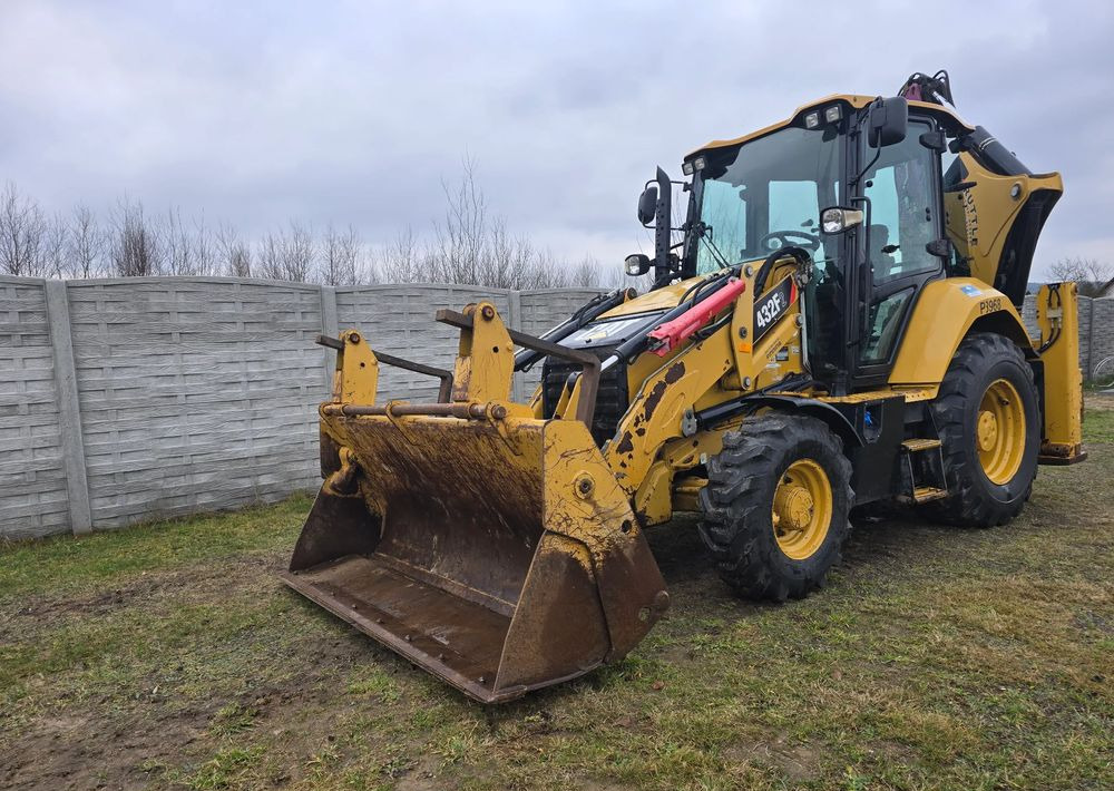 Caterpillar - Φορτωτής εκσκαφέας: φωτογραφία 1 Caterpillar - Φορτωτής εκσκαφέας: φωτογραφία 1