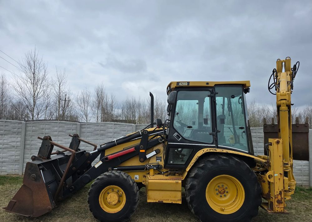 Φορτωτής εκσκαφέας Caterpillar: φωτογραφία 7 Φορτωτής εκσκαφέας Caterpillar: φωτογραφία 7