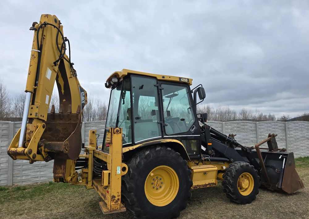 Φορτωτής εκσκαφέας Caterpillar: φωτογραφία 14 Φορτωτής εκσκαφέας Caterpillar: φωτογραφία 14