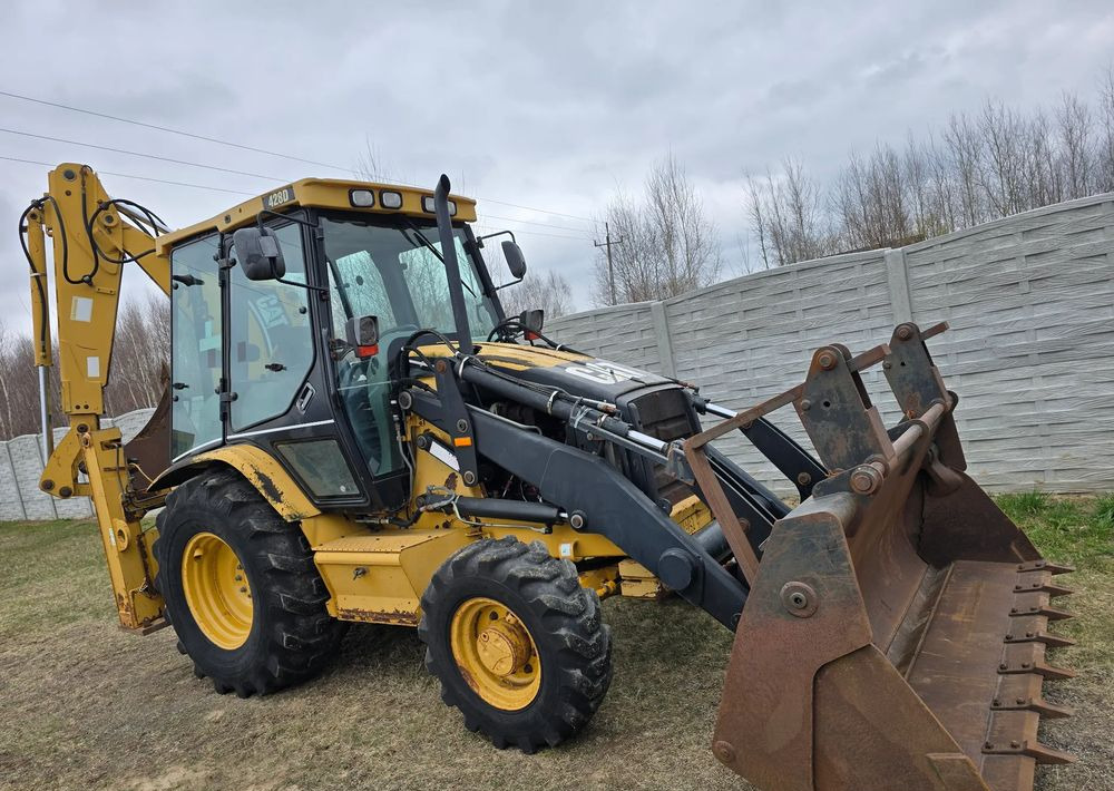 Φορτωτής εκσκαφέας Caterpillar: φωτογραφία 12 Φορτωτής εκσκαφέας Caterpillar: φωτογραφία 12