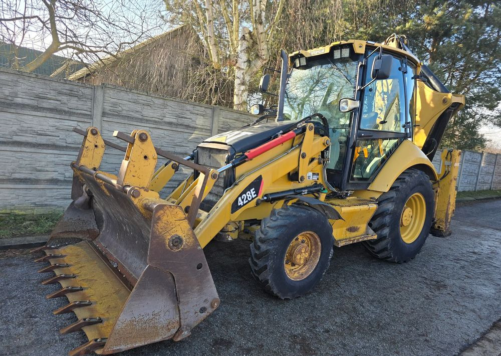 Caterpillar - Φορτωτής εκσκαφέας: φωτογραφία 1 Caterpillar - Φορτωτής εκσκαφέας: φωτογραφία 1