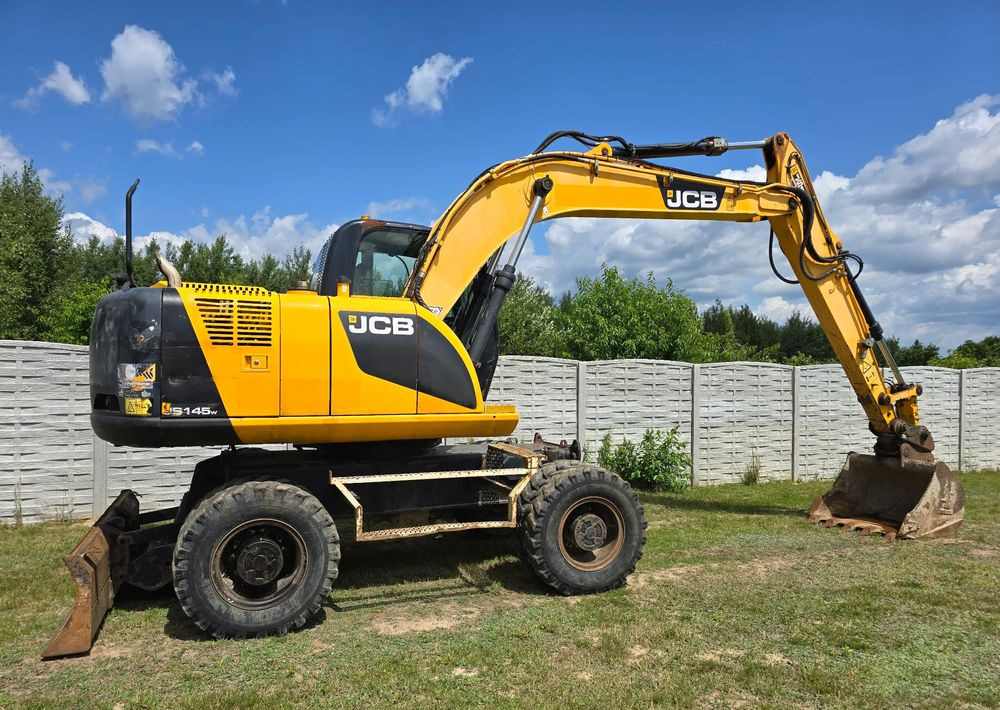 JCB - Τροχοφόρος εκσκαφέας: φωτογραφία 2 JCB - Τροχοφόρος εκσκαφέας: φωτογραφία 2