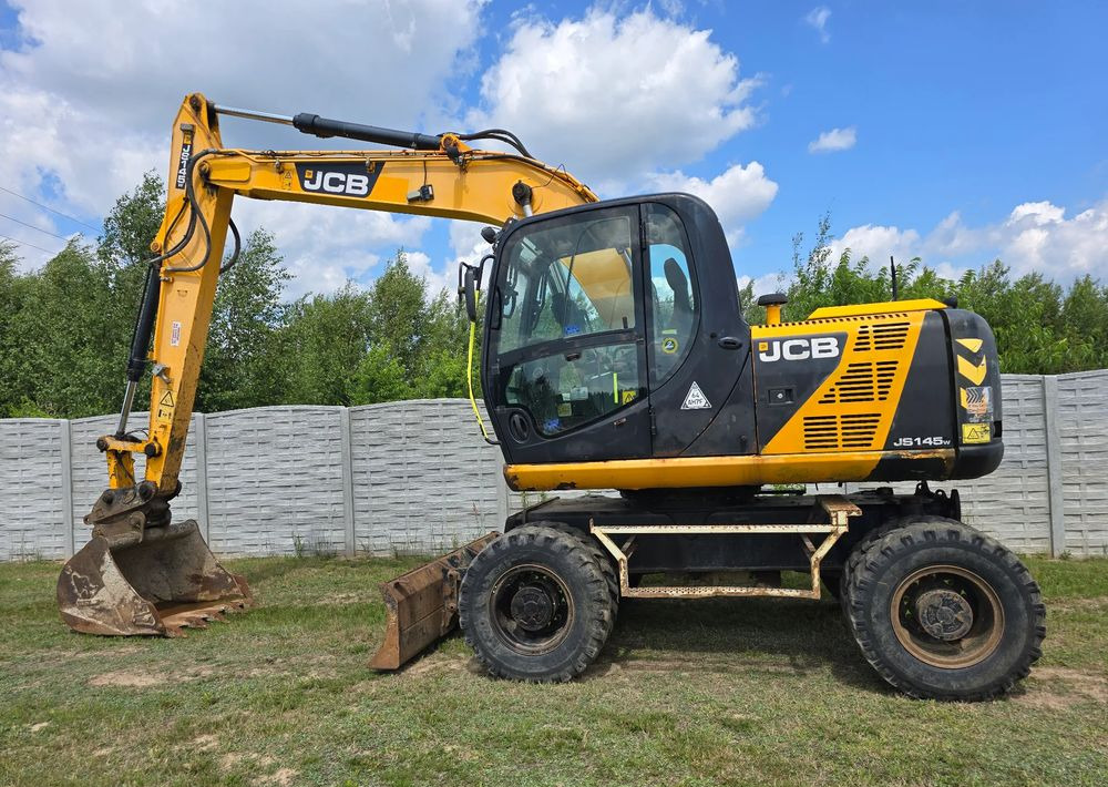 JCB - Τροχοφόρος εκσκαφέας: φωτογραφία 1 JCB - Τροχοφόρος εκσκαφέας: φωτογραφία 1