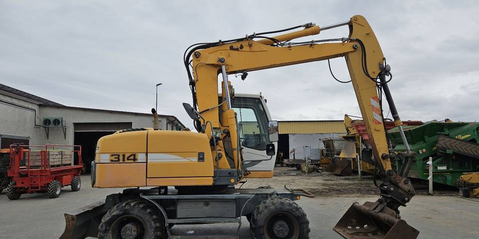 Koparka kołowa Liebherr A314 Litronic 9350 h 4 łyżki kołówka - Τροχοφόρος εκσκαφέας: φωτογραφία 5 Koparka kołowa Liebherr A314 Litronic 9350 h 4 łyżki kołówka - Τροχοφόρος εκσκαφέας: φωτογραφία 5