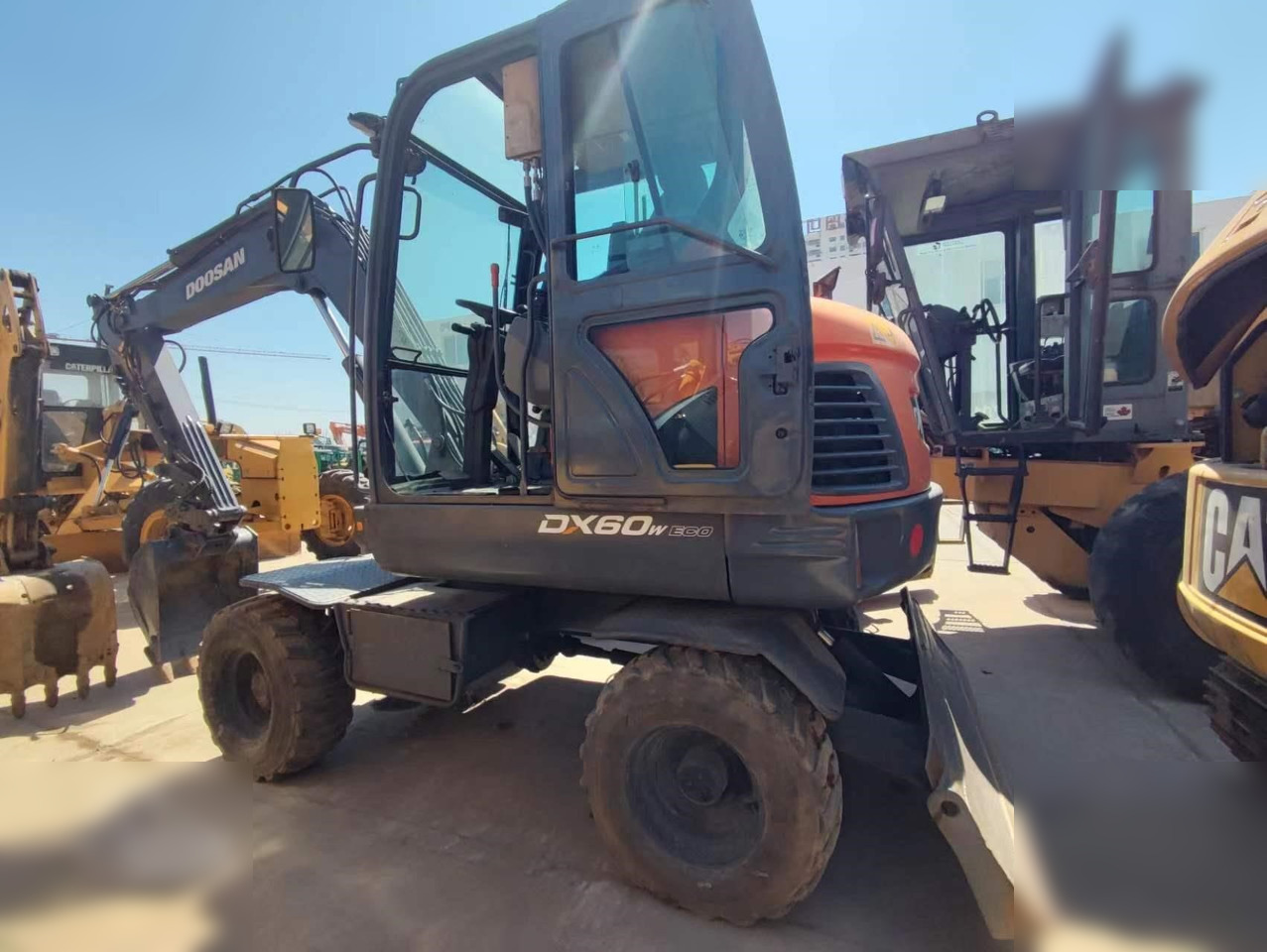 DOOSAN DX60W ECO - Τροχοφόρος εκσκαφέας: φωτογραφία 1 DOOSAN DX60W ECO - Τροχοφόρος εκσκαφέας: φωτογραφία 1