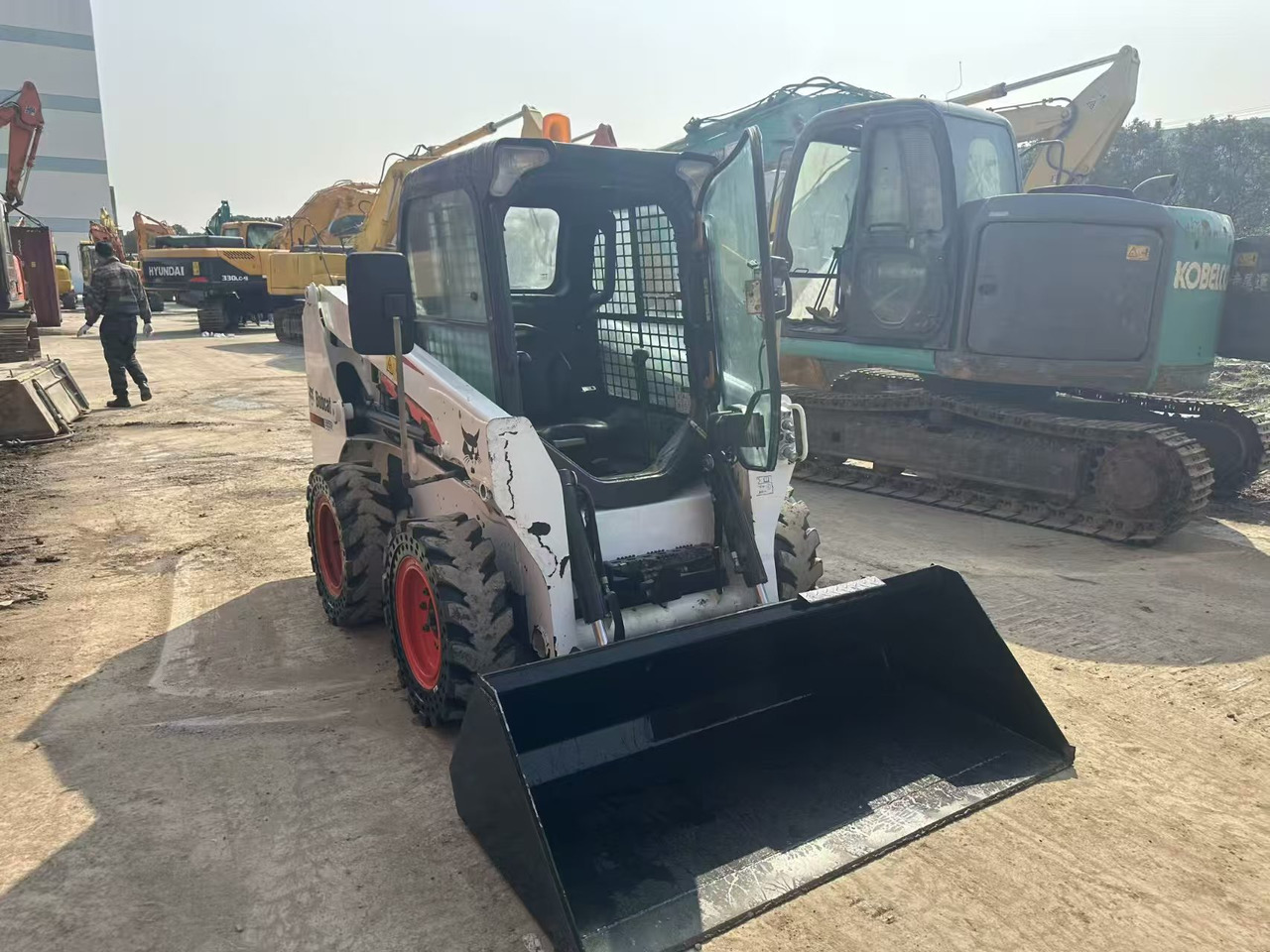 Ελαστιχοφόρος φορτωτής BOBCAT s550: φωτογραφία 11