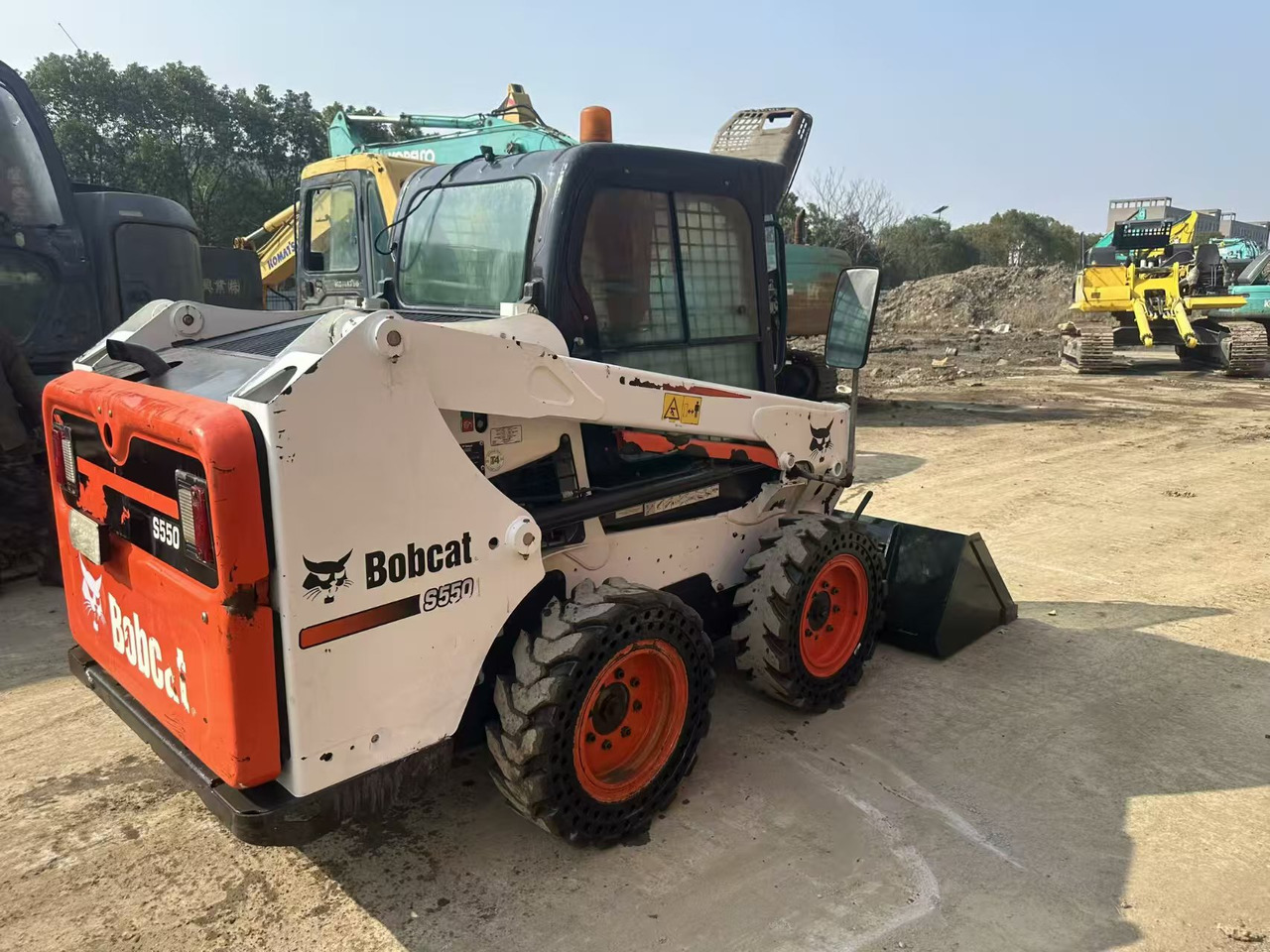 Ελαστιχοφόρος φορτωτής BOBCAT s550: φωτογραφία 10