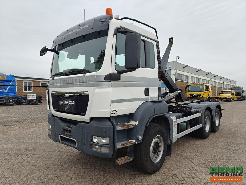MAN TGS-TGX 26.440 6x4 Dagcabine Euro5 - AJK 20T HaakarmSysteem - Volledig Bladgeveerd - Naafreductie - Handgeschakeld - Φορτηγό φόρτωσης γάντζου: φωτογραφία 1 MAN TGS-TGX 26.440 6x4 Dagcabine Euro5 - AJK 20T HaakarmSysteem - Volledig Bladgeveerd - Naafreductie - Handgeschakeld - Φορτηγό φόρτωσης γάντζου: φωτογραφία 1