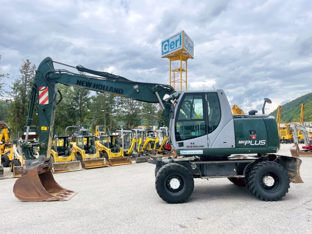 New Holland MH Plus (4054) - Τροχοφόρος εκσκαφέας: φωτογραφία 1 New Holland MH Plus (4054) - Τροχοφόρος εκσκαφέας: φωτογραφία 1